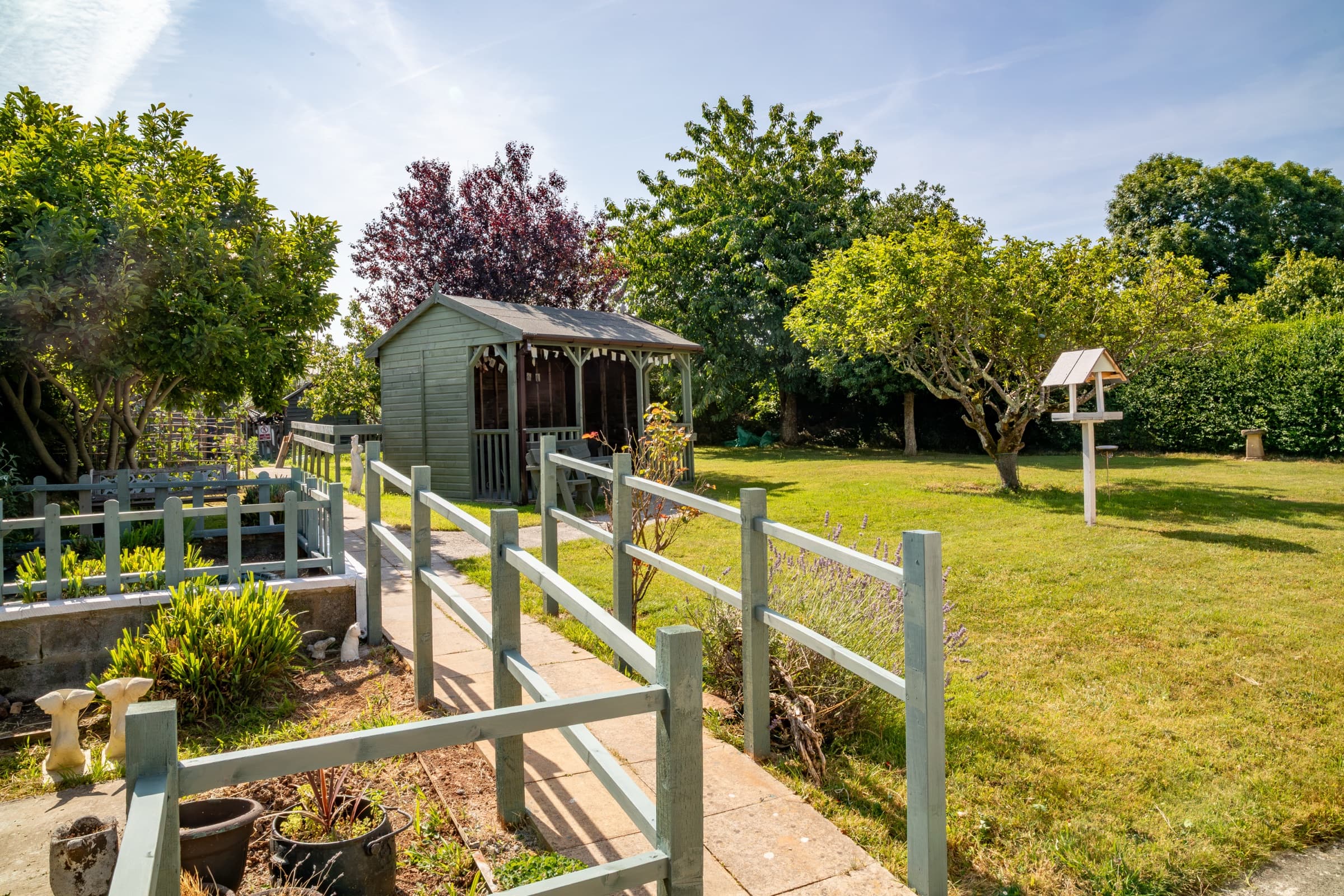 Path leading through the garden to the covered shelter